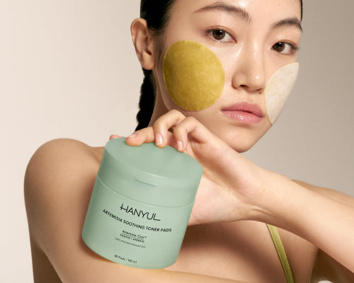 Woman showing mugwort toner pad