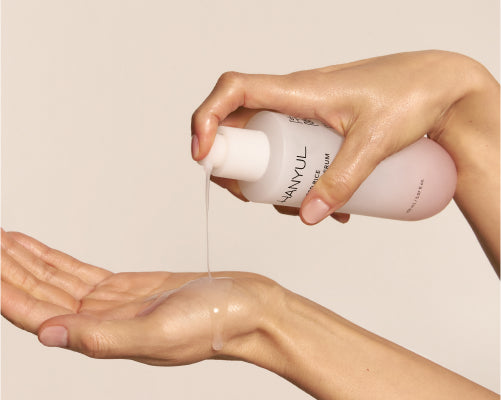 Applying RED RICE HYDRATING SERUM by hand