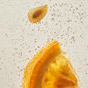 Close-up of yuja slice and seed on transparent background.
