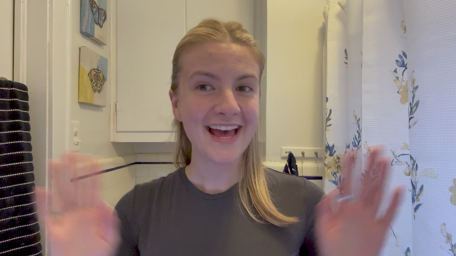 Skincare routine scene with a smiling woman in the bathroom.